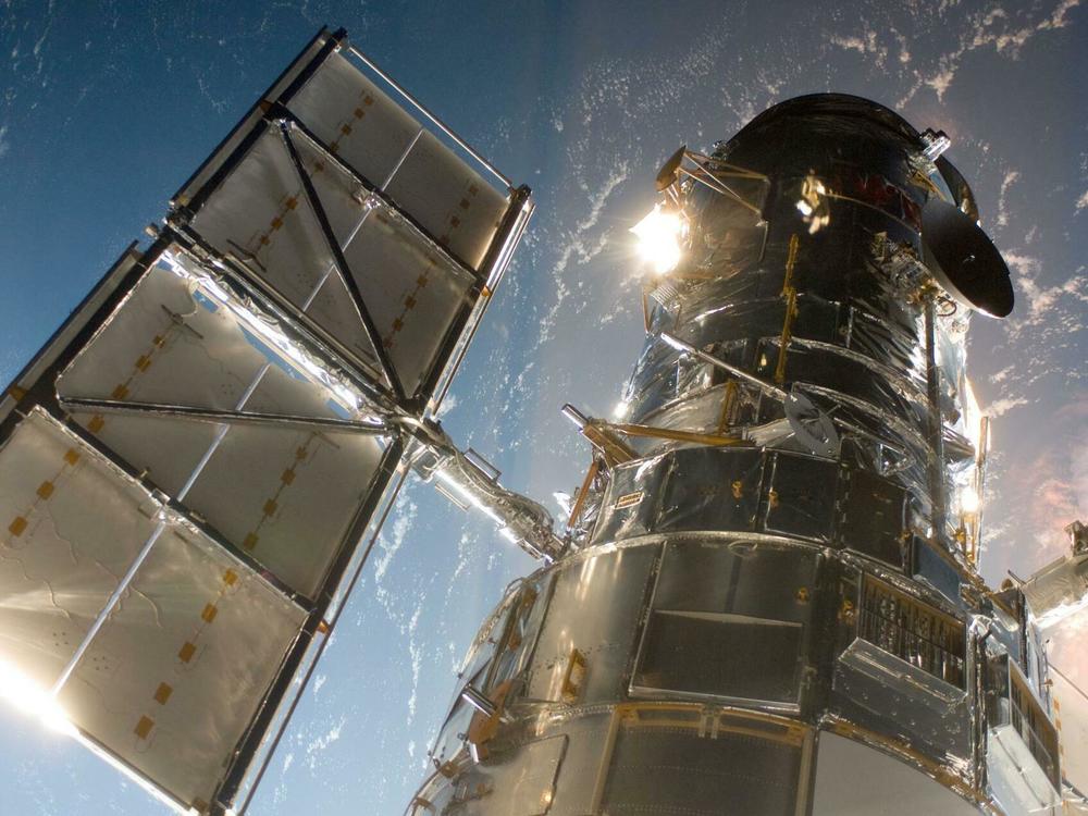 The Hubble Space Telescope just after space shuttle Atlantis captured it with its robotic arm on May 13, 2009, beginning the final mission to upgrade and repair the telescope.