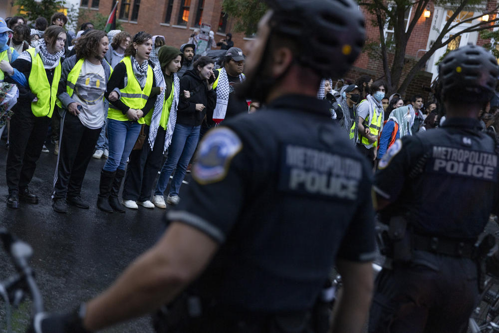 Protestors and police face each other during protests on George Washington University's campus in Washington, D.C. on May 9, 2024.