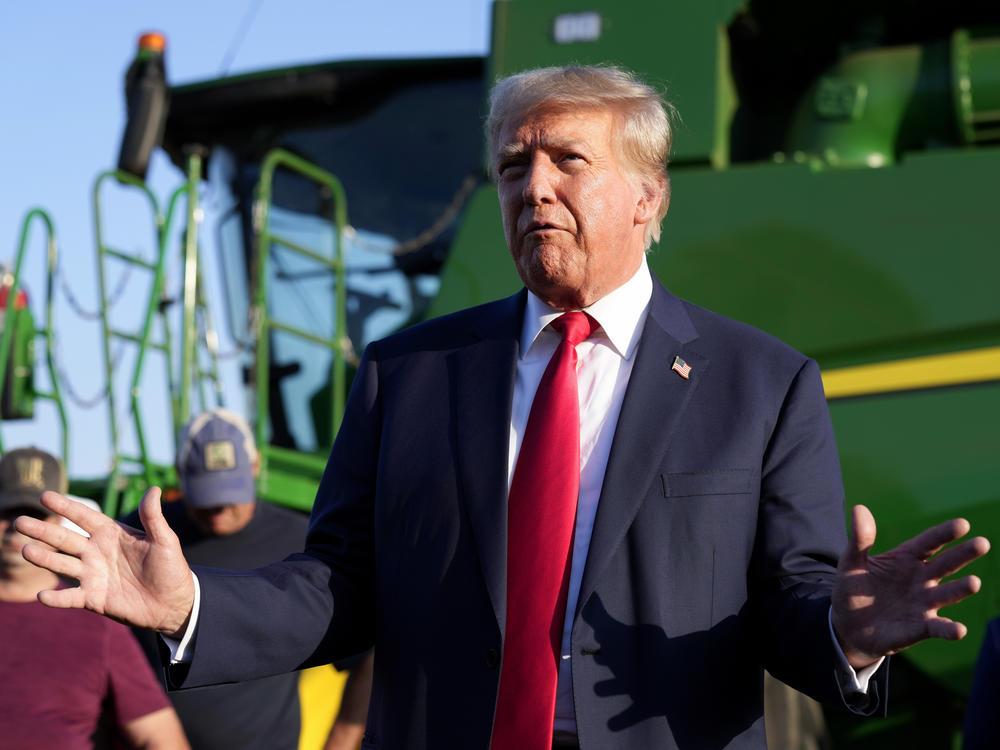 Former President Donald Trump speaks to reporters during a visit to a family farm in Leighton, Iowa, on Oct. 1, 2023.