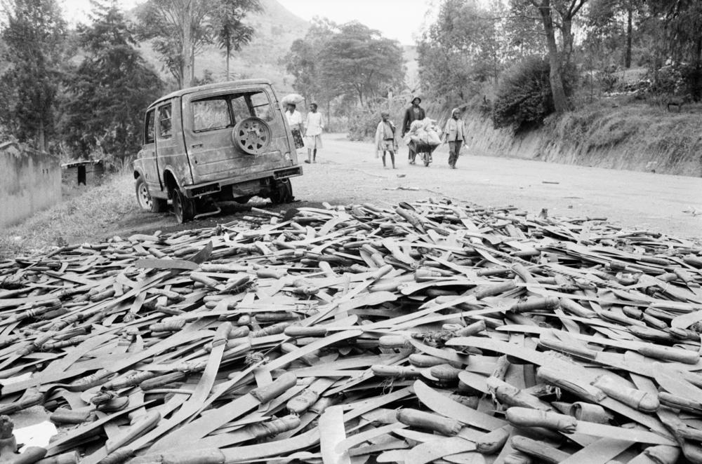 Thousands of abandoned machetes collect at the border of Rwanda and Tanzania.