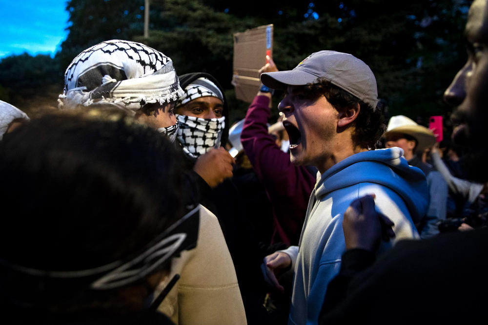 Following a talk by Turning Point USA founder Charlie Kirk, supporters clashed with University of Washington students and protesters who barricaded the east entrance to the encampment for Palestine on the Quad on Tuesday, May 7, 2024, in Seattle.