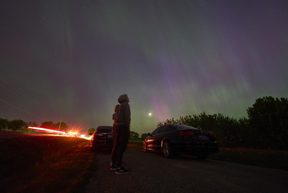 London, Ontario: People stop along a country road near London, Ontario to watch the Northern lights or aurora borealis during a geomagnetic storm on May 10, 2024.