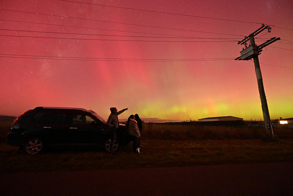 Christchurch, New Zealand: People look at the Aurora Australis, also known as the Southern Lights, in Rolleston on May 11, 2024.