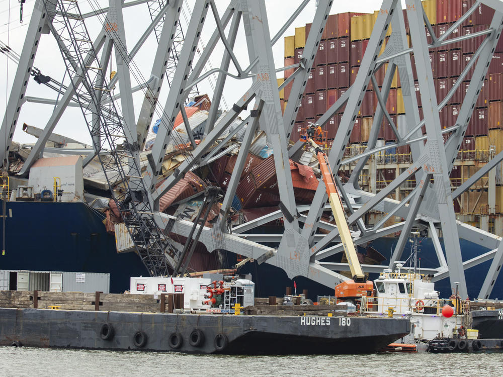 In this photo provided by the U.S. Army Corps of Engineers, salvors with the Unified Command prepare charges for upcoming precision cuts to remove Section 4 from the port side of the bow of the Dali container ship, May 7, 2024, during the Key Bridge Response, in Baltimore.