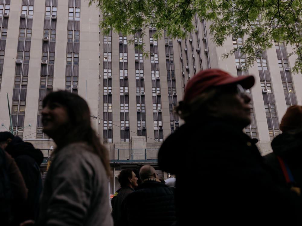 A line forms Monday outside the courthouse for a chance to sit in on the 16th day of former President Trump's hush-money trial in Manhattan, N.Y.