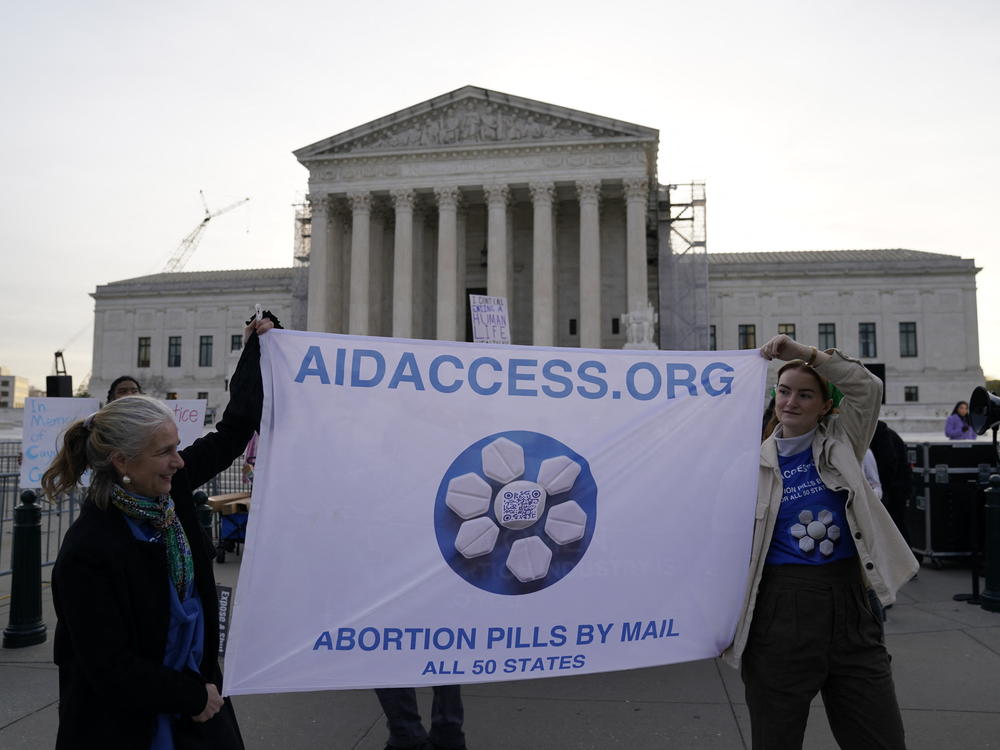 Abortion rights activists at the Supreme Court in Washington, D.C. on March 26, the day the case about the abortion drug mifepristone was heard. The number of abortions in the U.S. increased, a study says, surprising researchers.