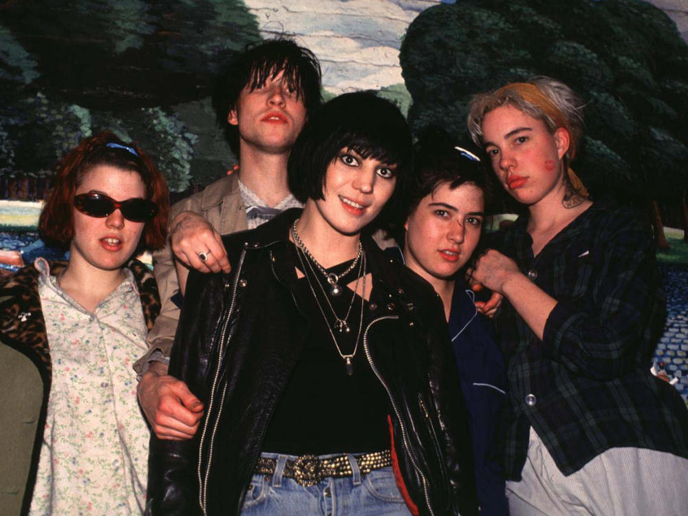 Hanna (fourth from left) poses with Joan Jett (center) and fellow with Bikini Kill members Tobi Vail, Billy Karren and Kathi Wilcox in New York City in 1992.