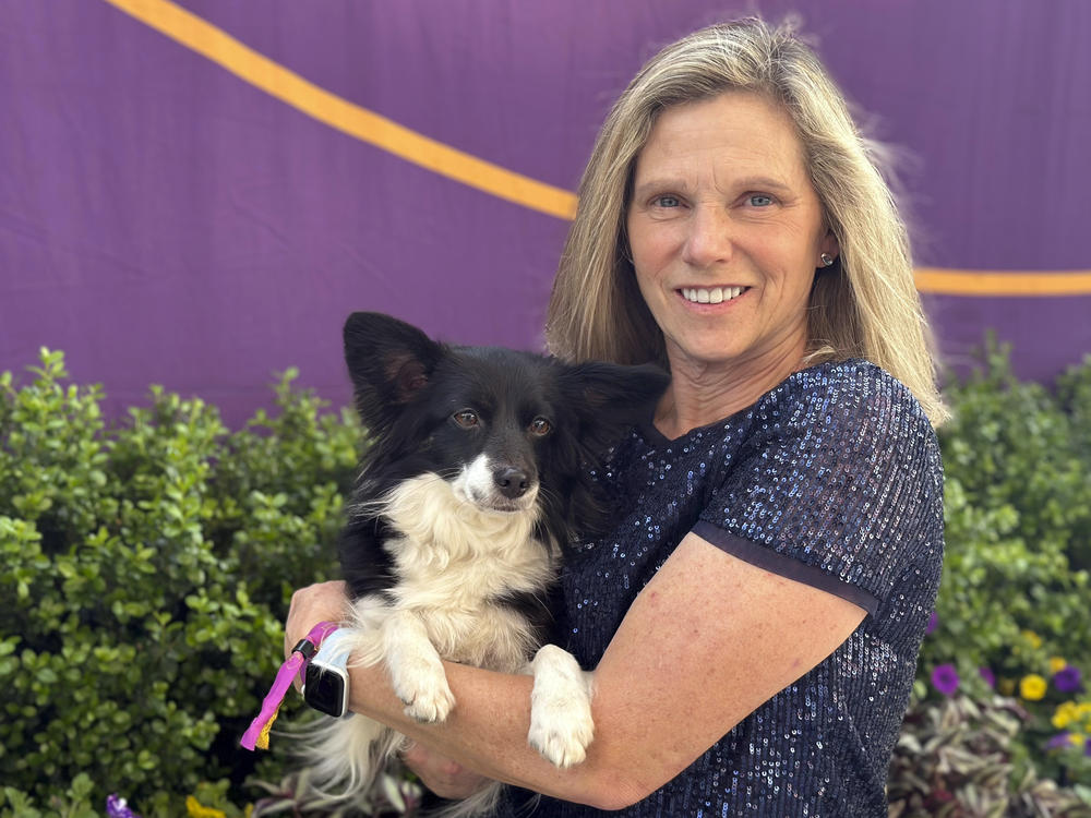 Cynthia Hornor poses with Nimble, the first mixed-breed dog ever to win the Westminster Kennel Club dog show's agility competition, in New York on Monday.