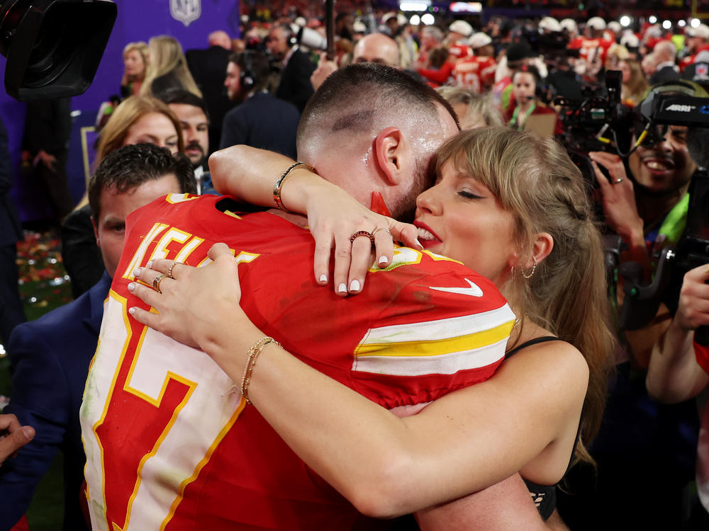 Travis Kelce of the Kansas City Chiefs embraces Taylor Swift after defeating the San Francisco 49ers during this year's Super Bowl in Las Vegas. Swift, who flew in from Tokyo to attend the game, jokingly told him, 