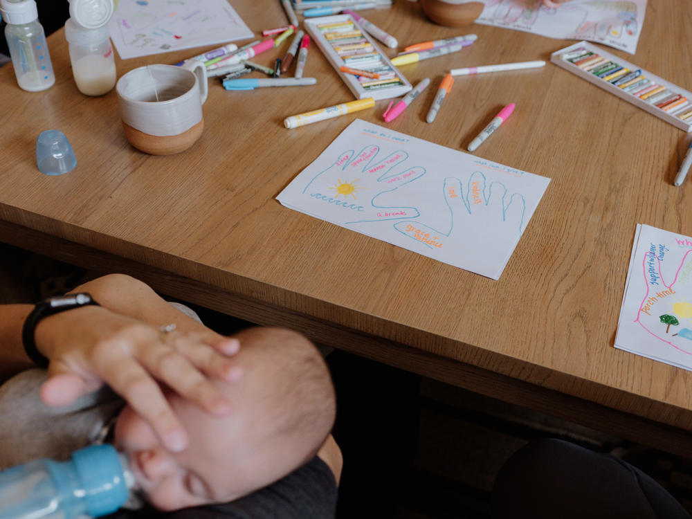 Mothers participate in an expressive art workshop where they are asked, 
