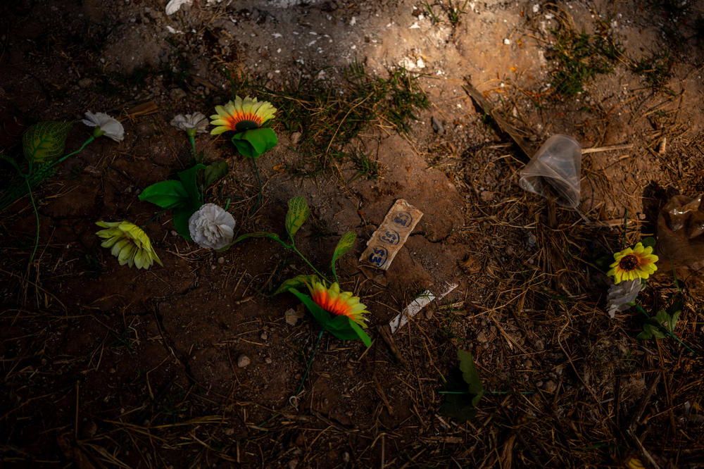 Plastic flowers, tickets and garbage in their hometown cemetery in Michoacán, a few days after Day of the Dead celebrations in November 2022.