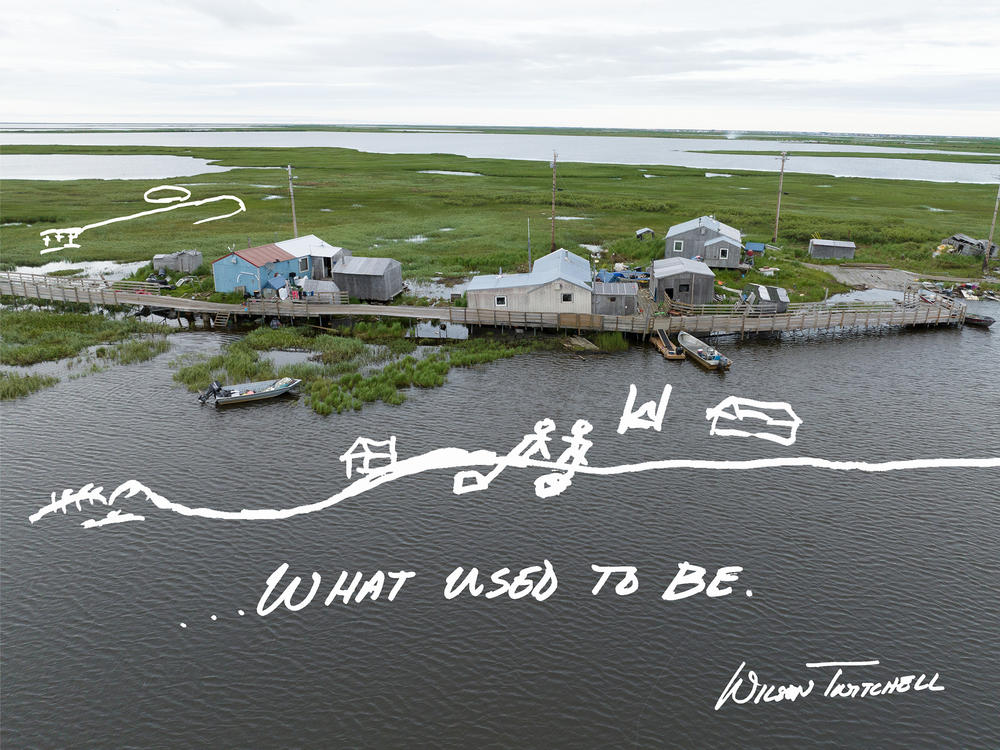 Bertha and Wilson Twitchell stand outside their home in Kasigluk, Alaska. Wilson grew up here. He drew an image of what the land looked like when he was young: Grass and dry land surrounded the house, stretching at least 80 feet to the riverbank, where he remembers playing with toy boats. Now, when the water is particularly high, the house is nearly an island.