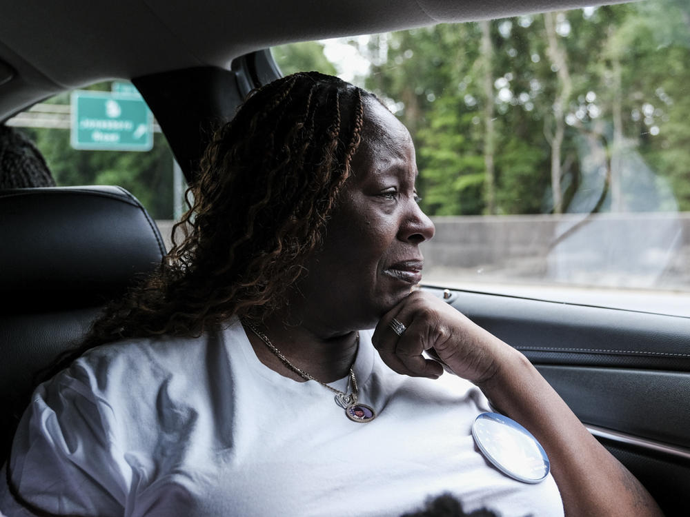 Chantimekki Fortson, Roger Fortson's mother rides in a car en route to Atlanta's Hartsfield-Jackson Airport to receive the transfer case of her son on Tuesday.