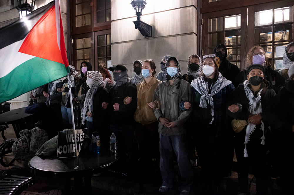 Pro-Palestinian students locked arms as they braced for New York Police Department officers to raid Columbia University's campus to dismantle encampments and remove protesters from Hamilton Hall on April 30.