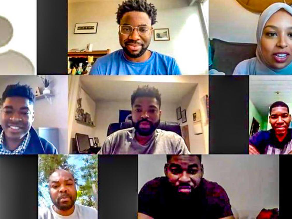 Honoré Prentice (top center, in glasses), who was adopted by a family in Canada, has a Zoom call with all five of his Haitian-born biological brothers during an interview with a reporter (upper right) for the CBC in Canada.