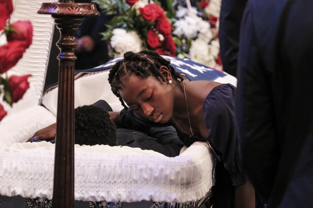 Harmoni Fortson pays her final respects to her brother, Roger Fortson.