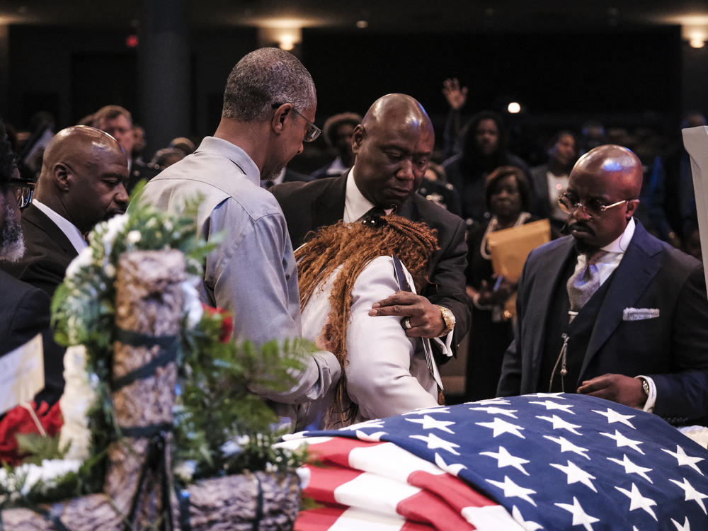 Fortson's mother, Chantimekki Fortson, pays her final respects to her son at his May 17 funeral service.