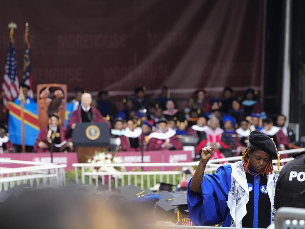 An attendee stands in protest with their back to President Biden as Biden speaks to graduating students at the Morehouse College commencement Sunday in Atlanta.