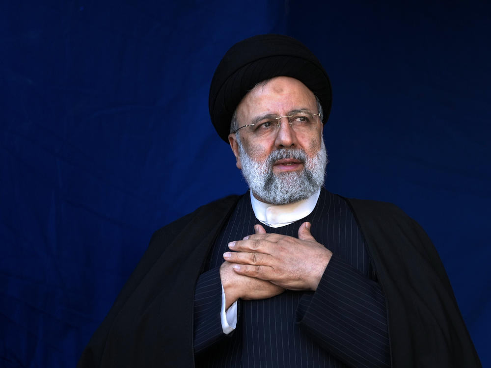 Iranian President Ebrahim Raisi is shown placing his hands on his heart as a gesture of respect to the crowd during the funeral ceremony of the victims of a bomb explosion in the city of Kerman, Iran, on Jan. 5, 2024.