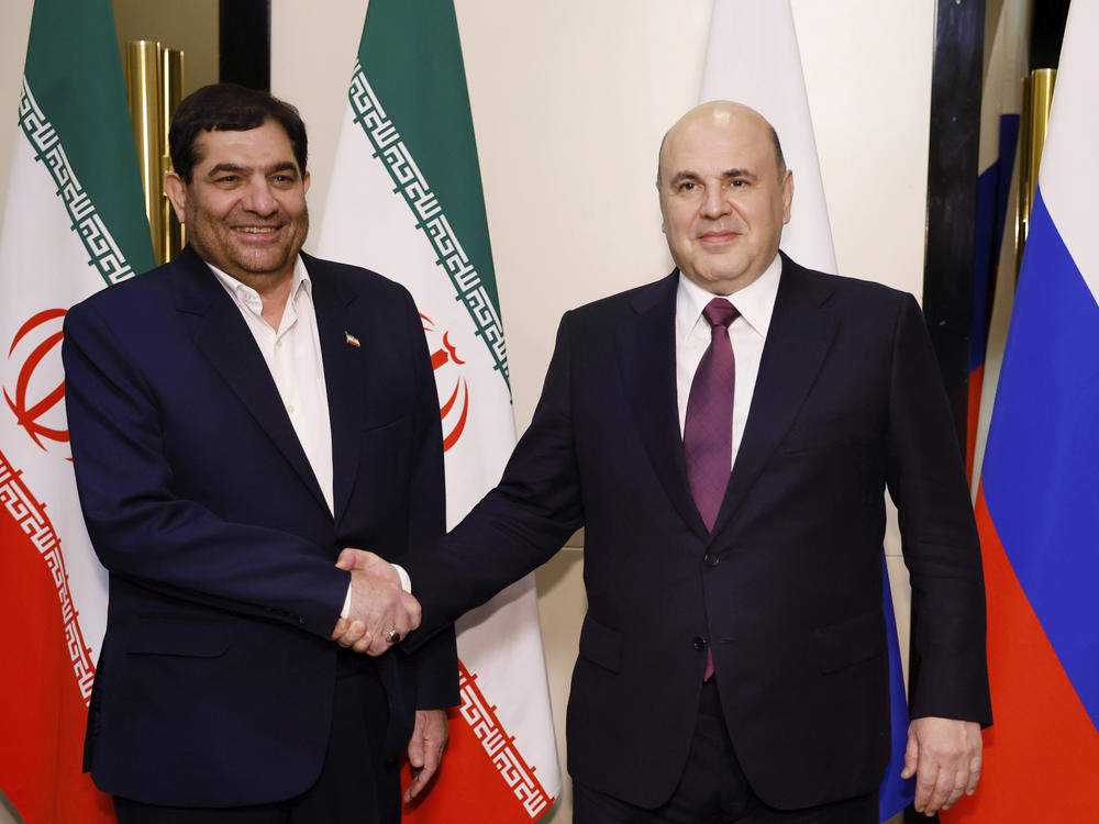 Russian Prime Minister Mikhail Mishustin, right, and Iranian First Vice President Mohammad Mokhber shake hands during a 2023 meeting in Kyrgyzstan.