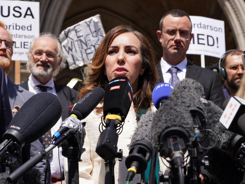 Stella Assange, the wife of Julian Assange, gives a statement outside the Royal Courts of Justice in London, after he won a bid at the High Court to bring an appeal against his extradition to the United States.