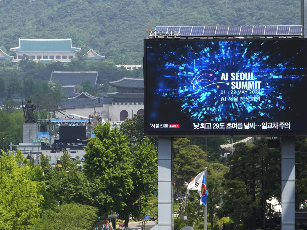 A screen shows an announcement of the AI Seoul Summit in Seoul, South Korea, on Tuesday.