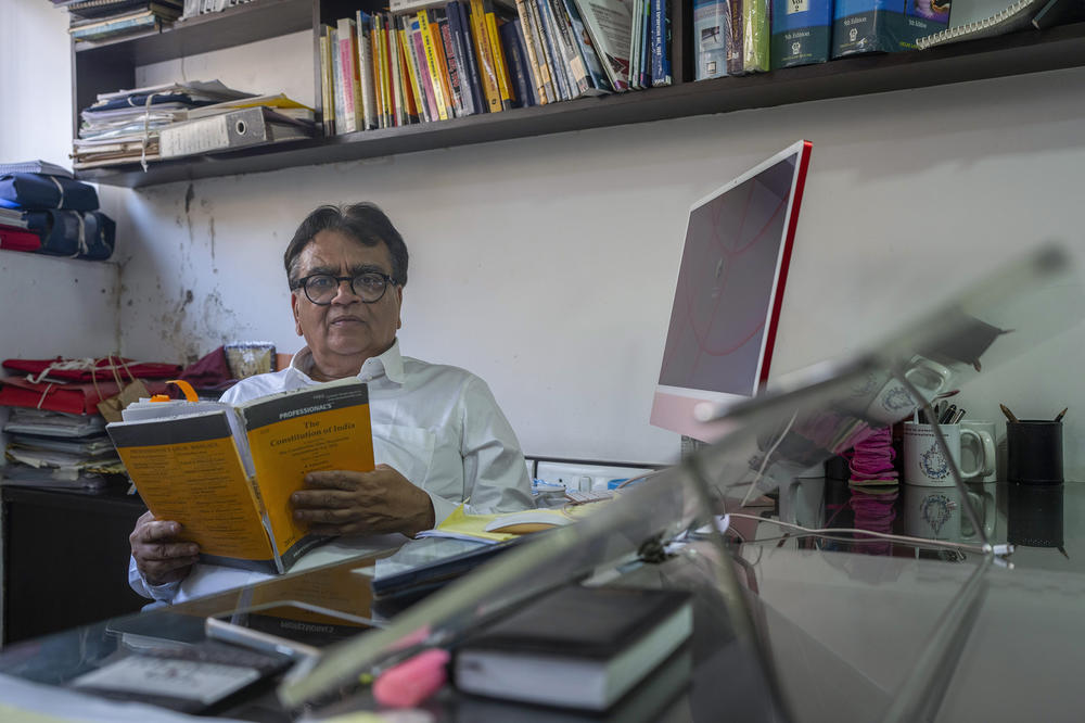 Lawyer Mihir Desai poses for a photograph at his office in Mumbai on April 3. Desai is defending a dozen political activists, journalists and lawyers jailed in 2018 on accusations of plotting to overthrow the Modi government.