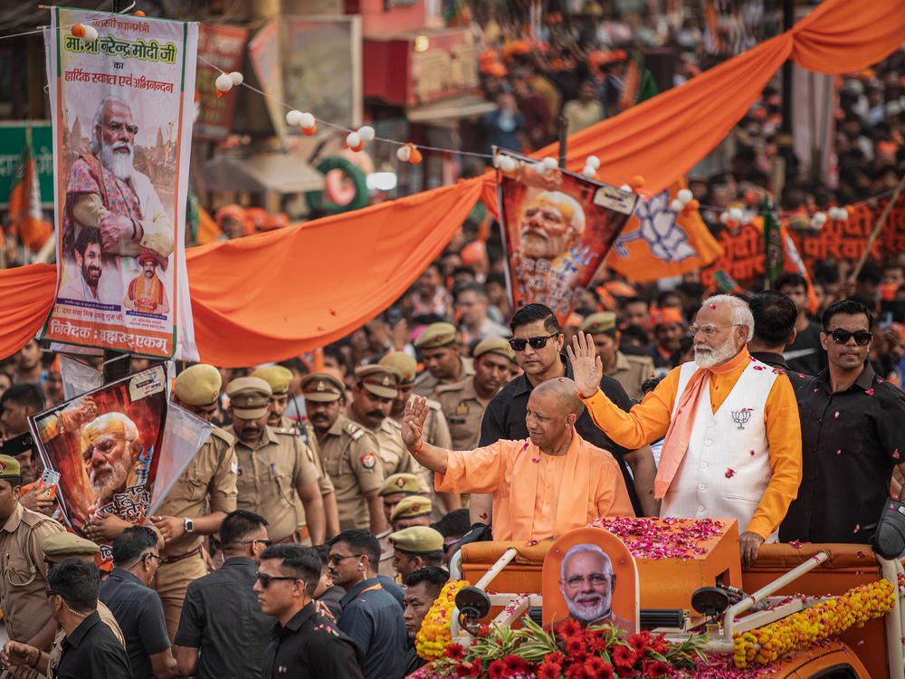 Indian Prime Minister Narendra Modi waves to supporters on May 13 in Varanasi, India.  