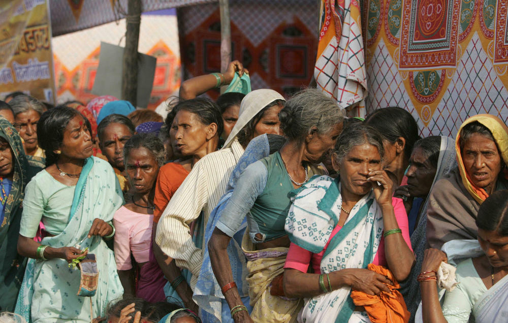 Lower-caste Dalit women wait for medical treatment in Mumbai on Dec. 6, 2006.