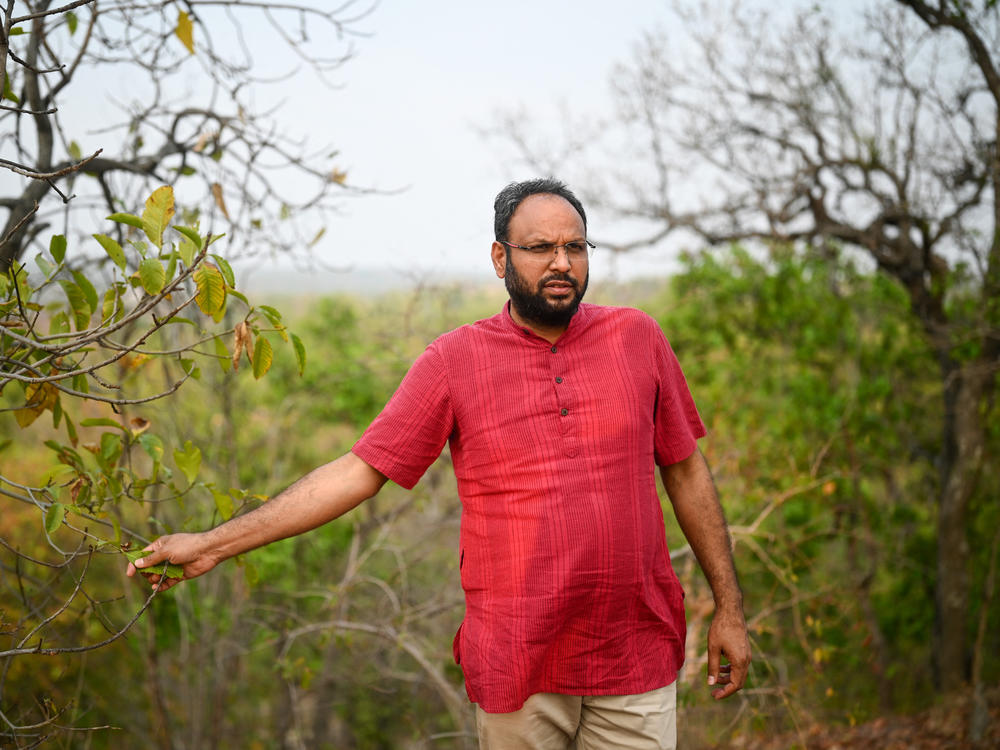 Alok Shukla walks across the Paturiyadand forest of Korba district in India's state of Chhattisgarh. Shukla has led a decade-long grassroots campaign against some of companies seeking to develop coal mines in forested areas.