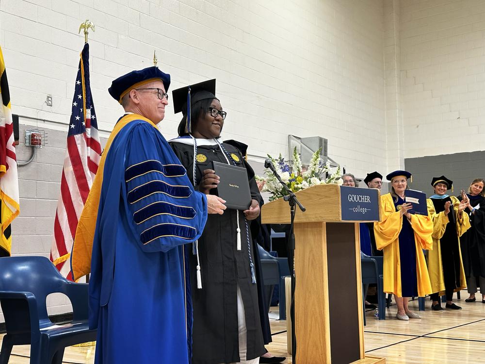Janet Johnson receives her college diploma from Kent Devereaux, president of Goucher College.