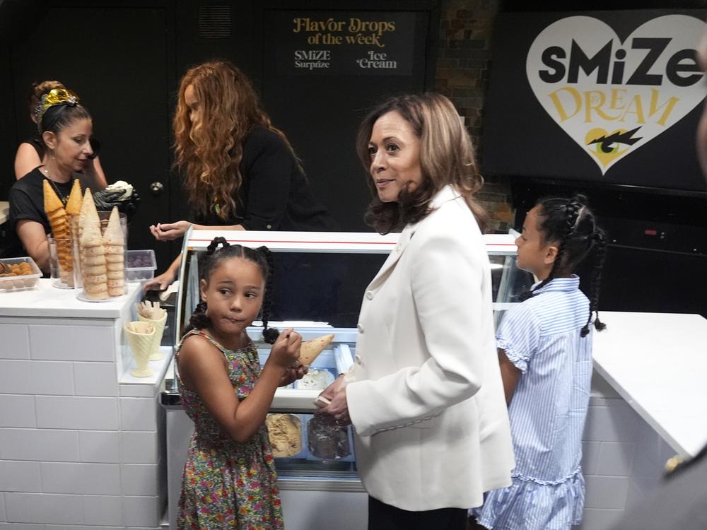 Vice President Harris and her grand-nieces get ice cream from a shop owned by Tyra Banks, center left, in Washington, on July 19.