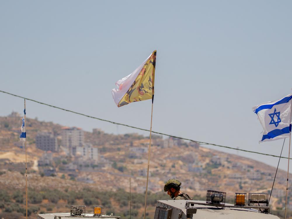Israeli soldiers and armored vehicles near the West Bank town of Beita 