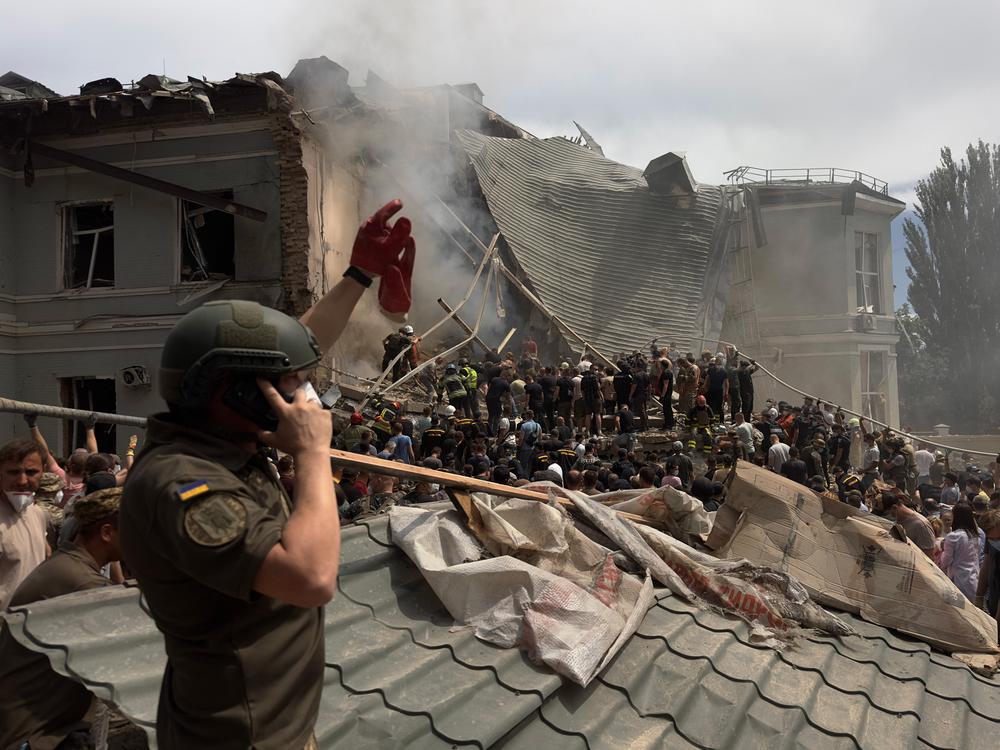 Rescuers clear the rubble of the destroyed Ohmatdyt Children's Hospital following a missile attack in Kyiv on July 8.