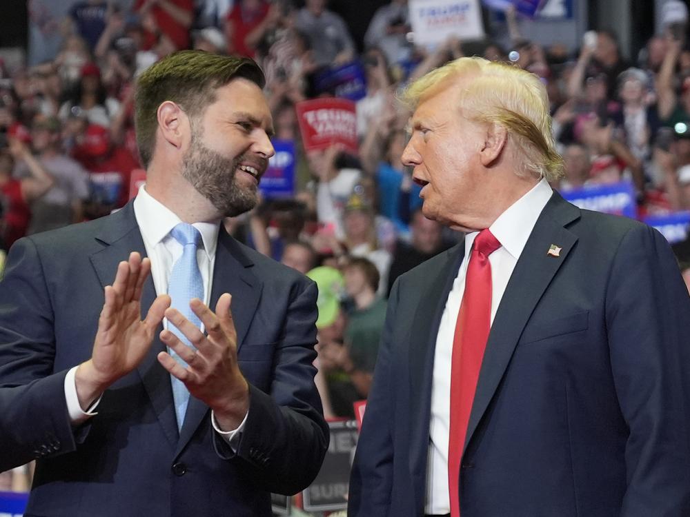 Former President Donald Trump and Republican vice presidential candidate Sen. J.D. Vance, R-Ohio, arrive a campaign rally on Saturday in Grand Rapids, Mich. 