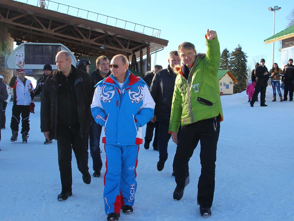 Russian President Vladimir Putin, center, once used the Olympic movement to burnish his country's reputation, hosting the 2014 Winter Games in Sochi. Plagued by doping scandals and accusations of war crimes, Russia and its athletes play a dwindling role in world sport.