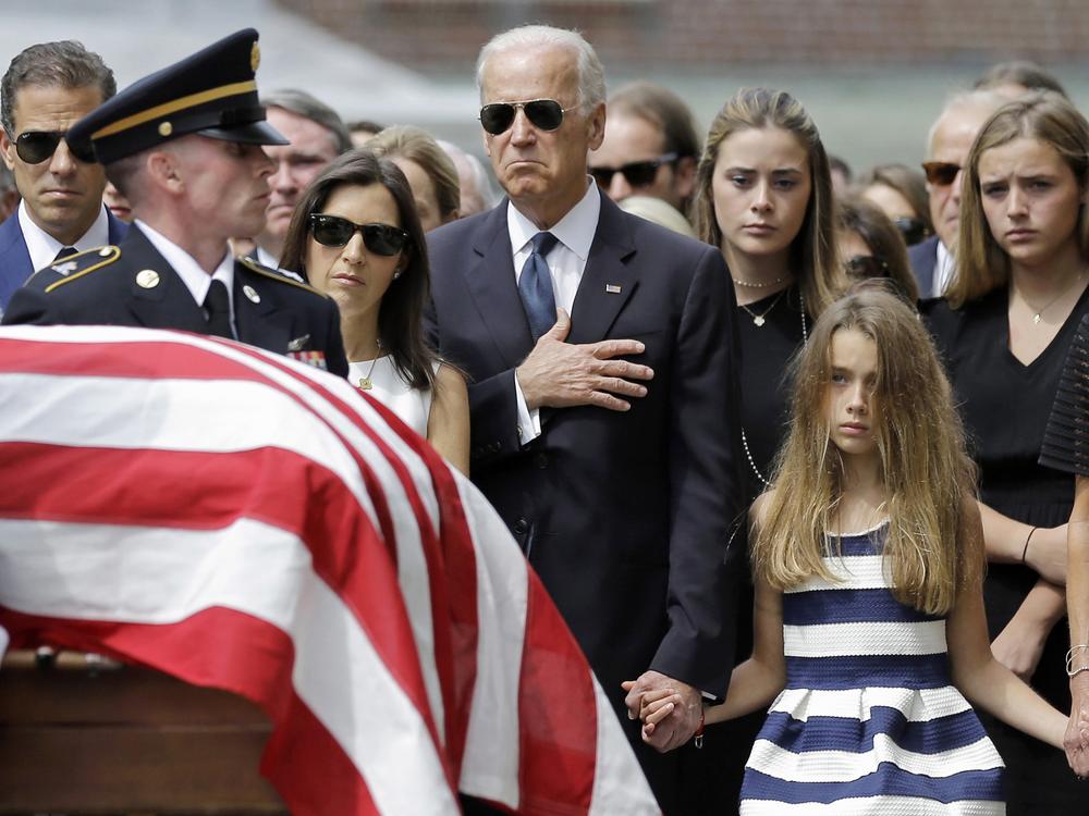 Vice President Biden and his family watch an honor guard carry the casket of Beau Biden into St. Anthony of Padua Roman Catholic Church in Wilmington, Del., on June 6, 2015.