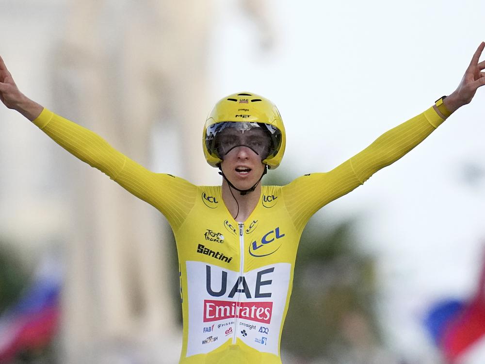 Slovenia's Tadej Pogacar celebrates Sunday as he crosses the finish line to win the twenty-first stage of the Tour de France cycling race, an individual time trial over 33.7 kilometers (20.9 miles) that started in Monaco and finished in Nice, France. 