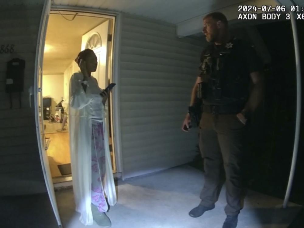 In this image taken from body camera video released by Illinois State Police, Sonya Massey, left, talks with former Sangamon County Sheriff’s Deputy Sean Grayson outside her home in Springfield, Ill., July 6, 2024.