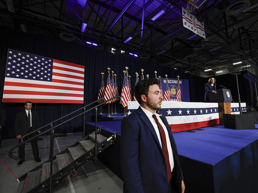 Members of the U.S. Secret Service stand watch as Vice President and Democratic Presidential candidate Kamala Harris speaks during her first campaign rally in Milwaukee, Wisconsin, on July 23, 2024. The assassination attempt on former president Donald Trump, the abrupt withdrawal of President Joe Biden from the race have added even more fuel to an active landscape of conspiracy theories about the 2024 campaign.