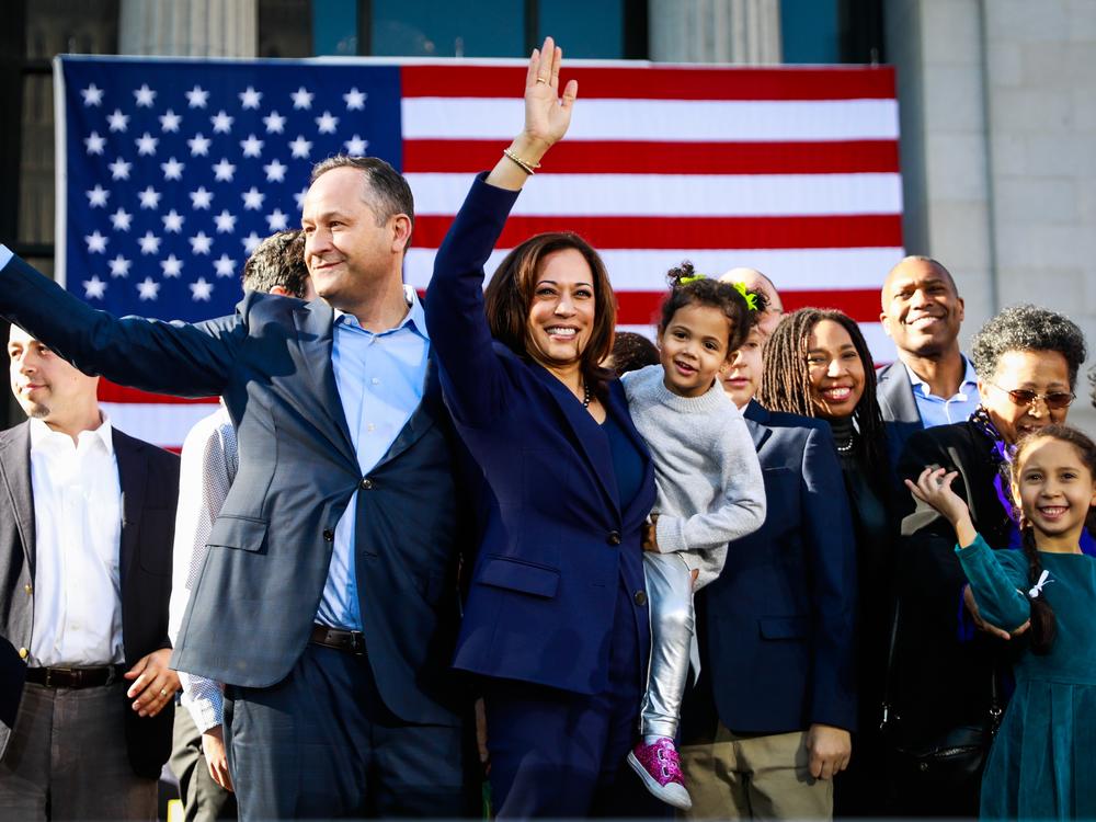 Senator Kamala Harris holds her niece Amara as she and her husband Douglas Emhoff wave to the crowd after hosting her first presidential campaign rally in her hometown of Oakland, California, on Sunday, Jan. 27, 2019. 