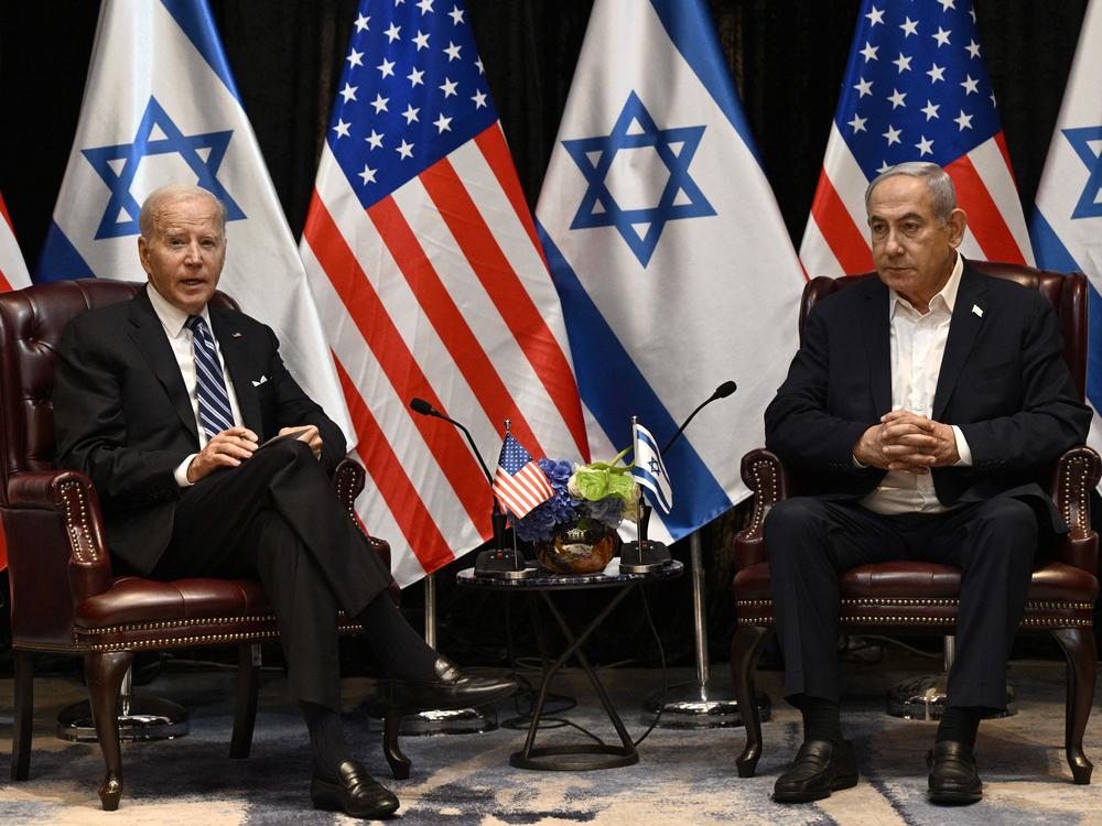 President Biden (left) listens to Israeli Prime Minister Benjamin Netanyahu as he joins a meeting of the Israeli war cabinet  in Tel Aviv, Israel, on Oct. 18.
