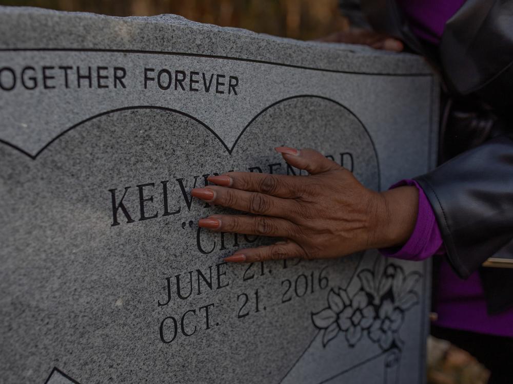 Melinda Mattocks-Ushry visits her brother’s grave at a cemetery in the outskirts of Oriental, N.C., on Dec. 5, 2023.