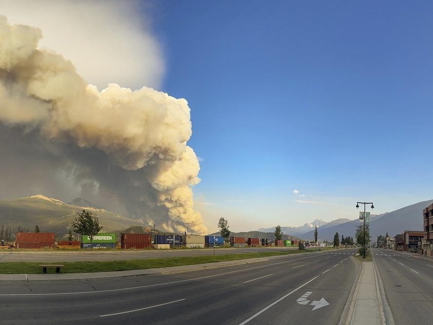 In this photo released by the Jasper National Park, smoke rises from a wildfire burning near Jasper, Alberta, Canada, on Wednesday.