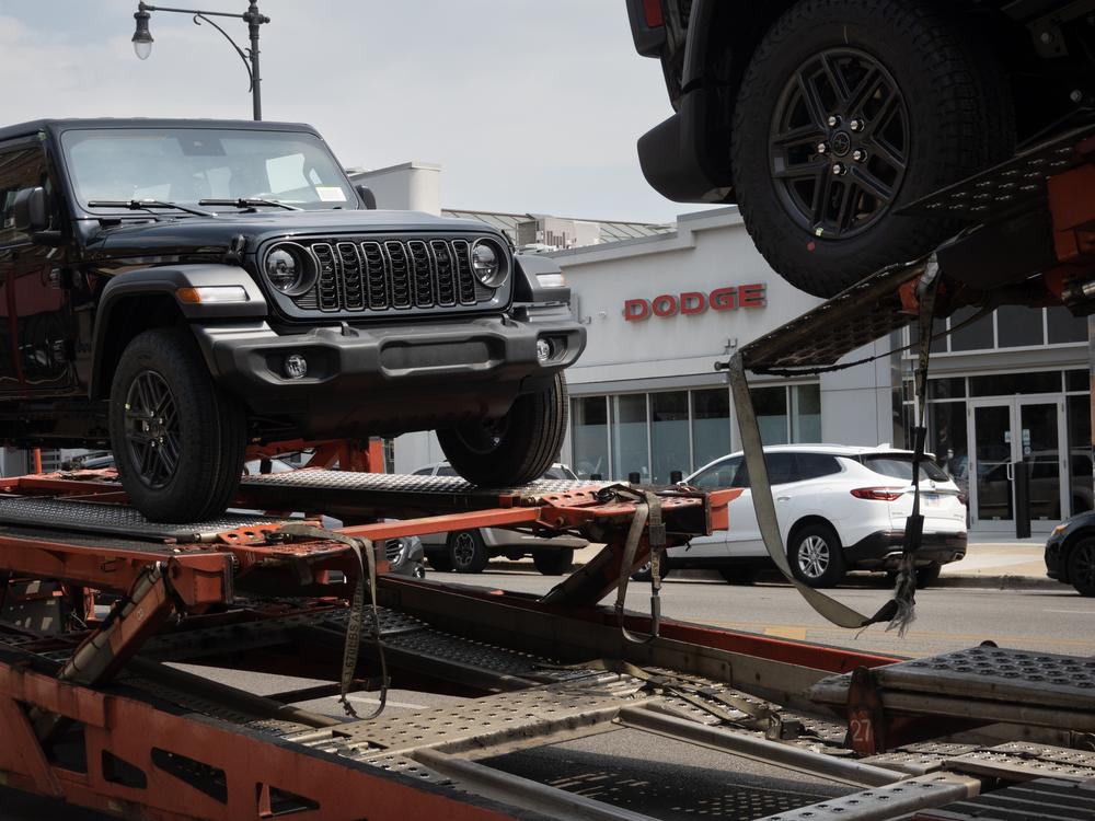 Jeeps are delivered to a dealership in Chicago on June 20. Stellantis, the parent company of Jeep, reported disappointing earnings for the first half of 2024. 