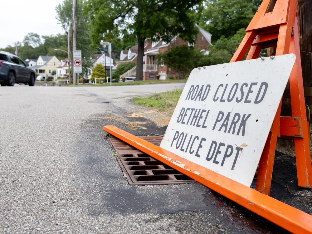 In the days following the shooting, investigators closed off the street where the gunman lived.  