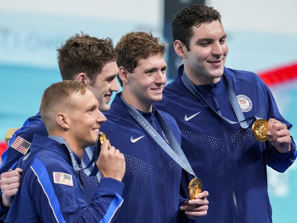 The United States men's 4x100-meter freestyle relay team celebrate after winning the gold medal at the 2024 Summer Olympics on Saturday in Nanterre, France.