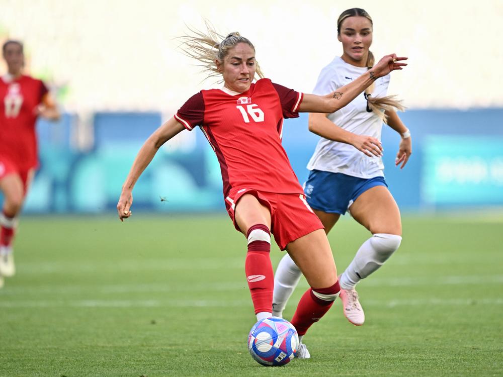 New Zealand midfielder Macey Fraser (right) and Canada forward Janine Beckie fight for the ball during the group match at the Paris 2024 Olympic Games in Saint-Etienne on Thursday.