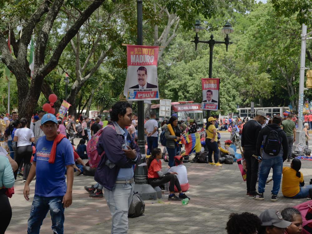 People attend the closing campaign of President Nicolás Maduro in Caracas, where stages were set up all over the city, and people were bussed in from various states of the country, on Thursday.