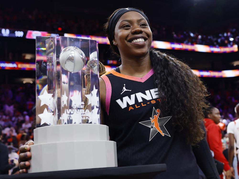 Arike Ogunbowale, who was left off the U.S Women's Olympic squad, celebrates with the MVP trophy after Team WNBA defeated the Olympic team 117-109 during the 2024 WNBA All Star Game in Phoenix, Ariz. on July 20, 2024.